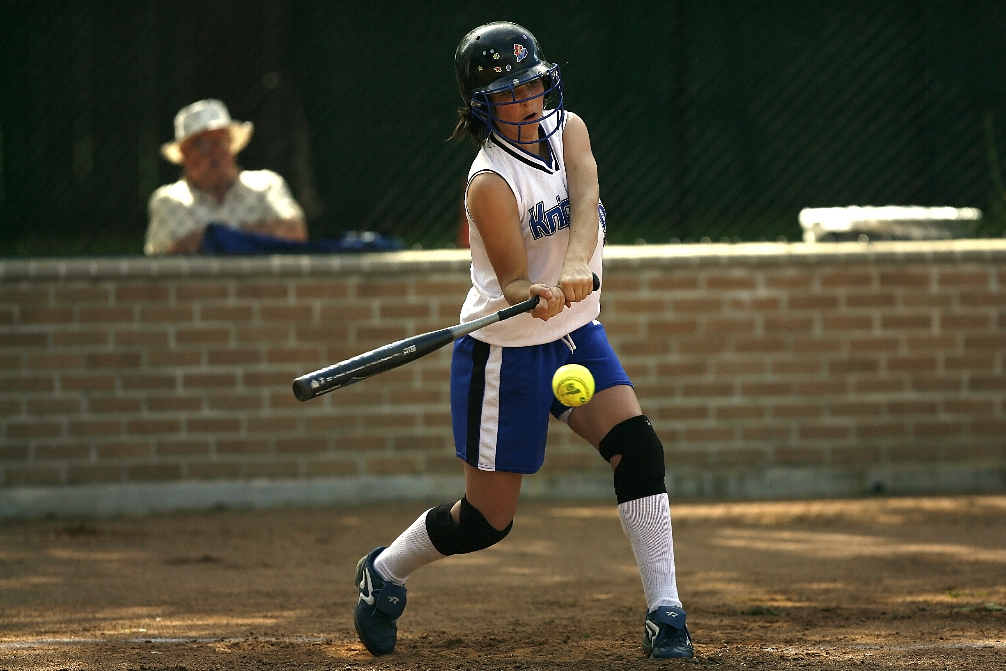 Girl Swinging Fastpitch Softball Bat